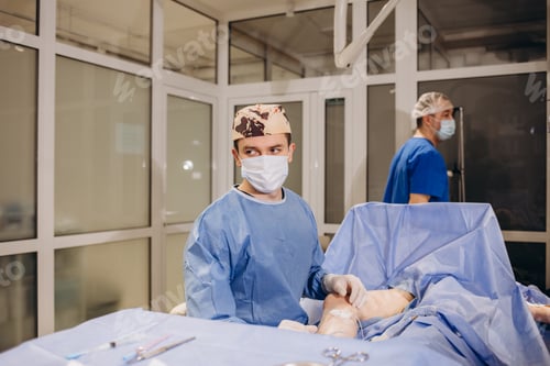 Preview: doctor and an assistant in the operating room for surgical venous vascular surgery clinic