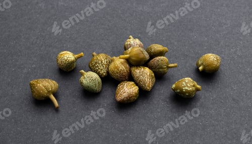 Preview: Pickled capers isolated on black background, close up