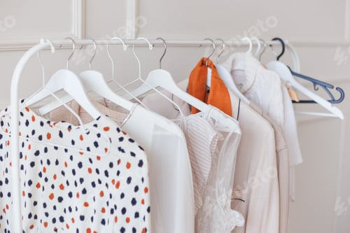 Preview: Clothes hang on a shelf in a designer clothes store