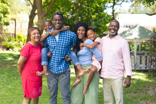 Preview: Happy Family Smiling Together in a Green Park
