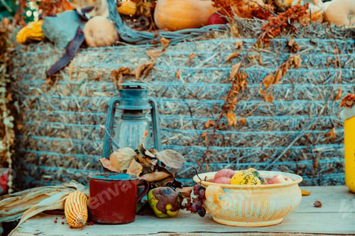 Preview: Iron lantern and autumn decoration on the table in a garden