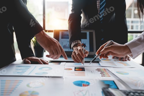 Preview: Businessman attending a meeting pointing to a graph to think about market data new product plan