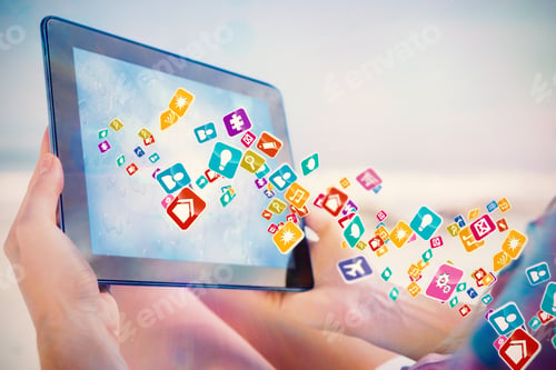 Preview: Woman Sitting On Beach In Deck Chair Using Tablet Pc Showing Colourful Computer Applications