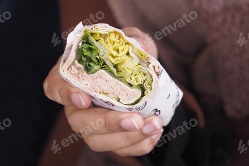Preview: A Freshly Made Wrap Filled with Tasty Greens and Juicy Chicken