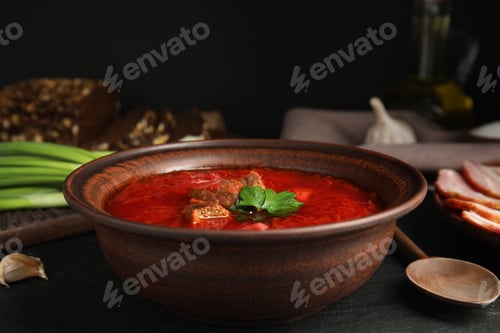 Preview: Stylish brown clay bowl with Ukrainian borsch served on black table