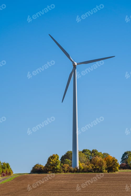 Preview: Wind Turbine against clear blue sky on a sunny day