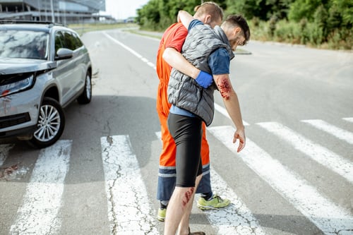 Preview: Medic walking with injured man after the accident