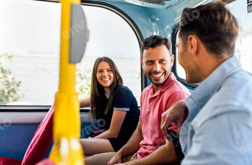 Preview: UK, London, three friends sitting in a double decker bus talking