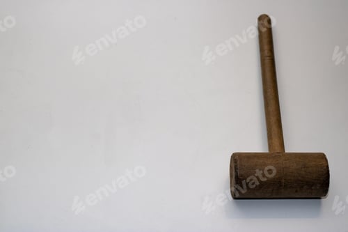 Preview: An Old Wooden Mallet Hammer On A White Background.