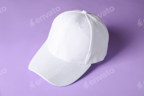 Preview: White baseball hat on violet background, above view. Mockup for design