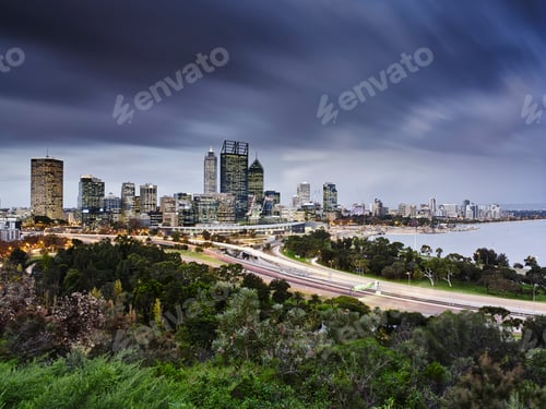 Preview: City skyline against a dramatic cloudy sky at twilight