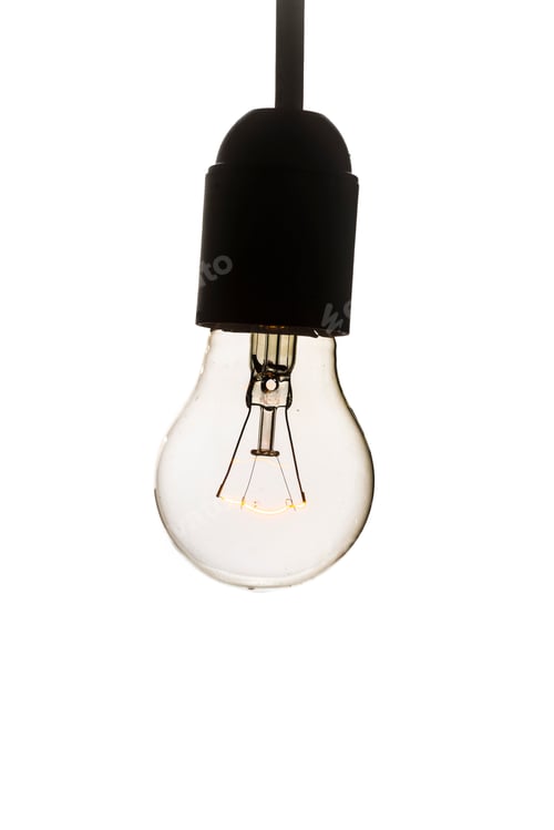 Preview: Glowing Filament in a Lightbulb Against White Backdrop