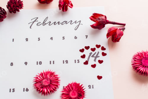 Preview: Small red hearts highlight the date February 14 on the calendar sheet and dry flowers