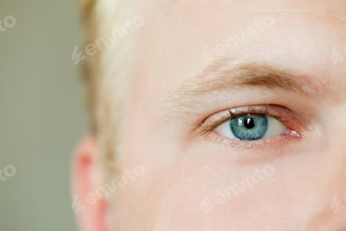 Preview: Upclose view of a person with a striking blue eye