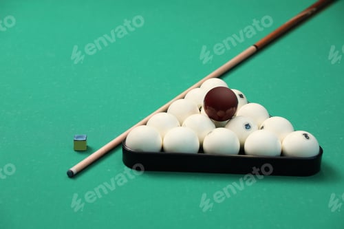 Preview: Billiard balls in triangle rack, cue and chalk on table