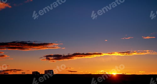 Preview: Truck driving on the asphalt road transportation at sunset