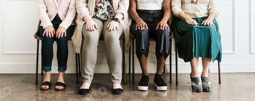 Preview: Women sitting in a row
