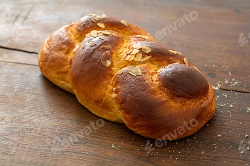 Preview: Sweet bread, easter greek tsoureki braid on wood background