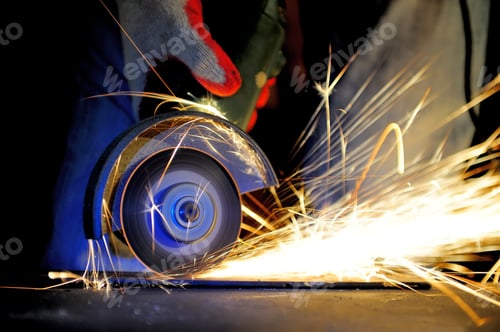 Preview: Worker cutting metal with grinder