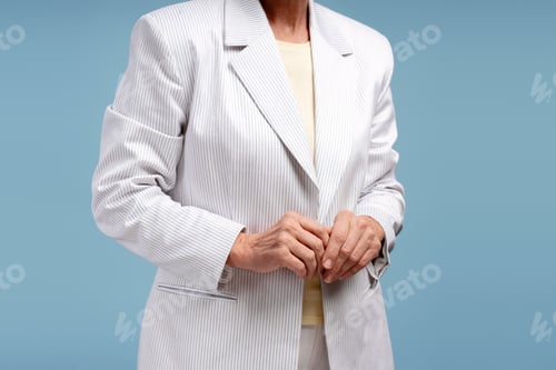 Preview: Stylish adult in striped blazer on blue background