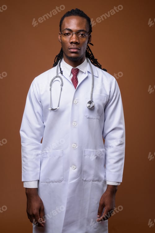 Preview: Young handsome African man doctor against brown background