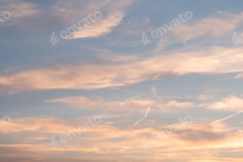 Preview: The sky at sunset is filled with bright and vibrant colors, complemented by fluffy clouds.
