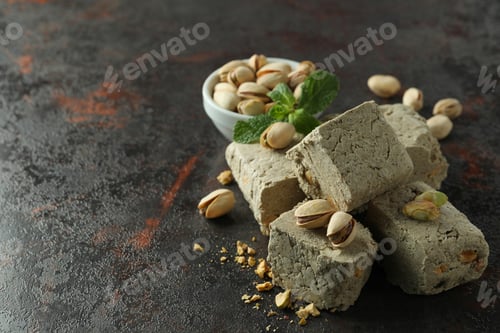 Preview: Concept of tasty food with halva on dark textured background
