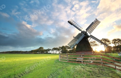 Preview: charming Dutch windmill ats sunrise