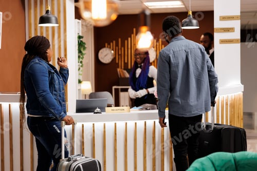 Preview: Greeting guests at hotel front desk