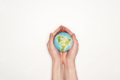 Preview: cropped view of female hands with globe model on white background, global warming concept