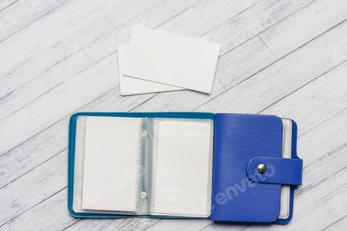 Preview: business card holder with forms on a wooden table top view close-up