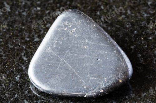 Preview: sample of polished ilmenite mineral on black