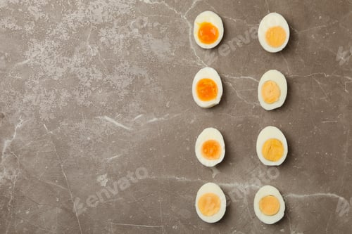 Preview: Flat lay with boiled eggs on gray background, top view