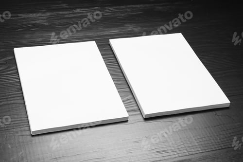 Preview: Blank paper sheets for brochure on black wooden background. Mock up