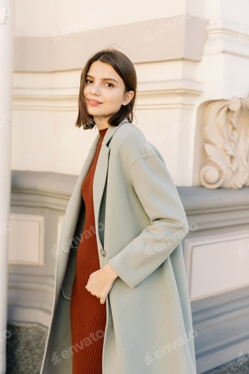 Preview: Young beautiful stylish woman walking in street in autumn fancy outfit.