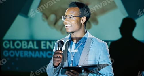 Preview: Black man, conference and presentation with tablet for speech notes, information and discussion of