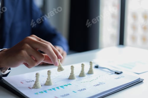 Preview: Businessman playing chess game. Business strategy, leadership, planning and management concept.