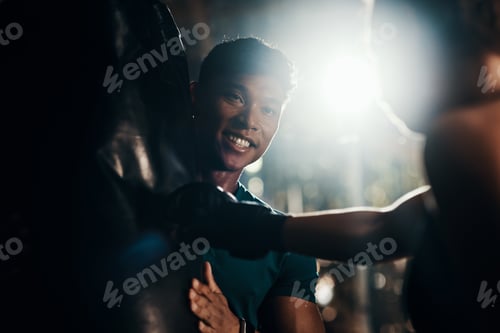 Preview: Cropped shot of a handsome young male fitness instructor coaching a female boxer in a gym