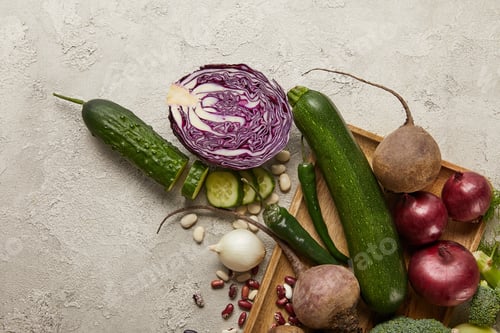 Preview: Top view of vegetables and beans on wooden tray