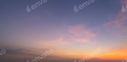 Preview: Sunset sky. Abstract nature background. Dramatic blue and orange, colorful clouds at twilight time.