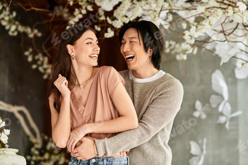 Preview: Couple joyfully preparing for their wedding amidst vibrant floral arrangements in a cozy venue