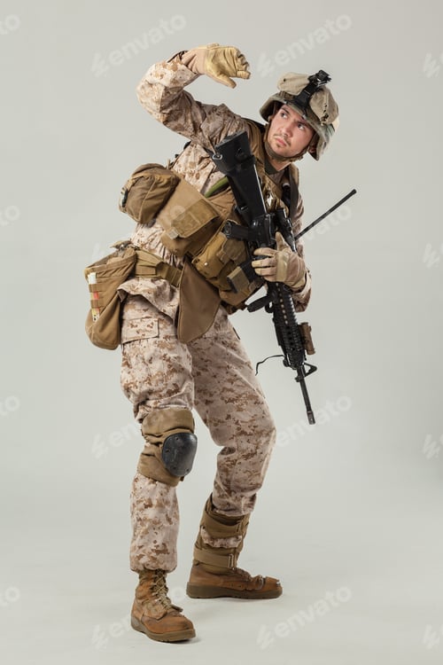 Preview: Soldier in tactical gear holding a weapon during training exercise at indoor location