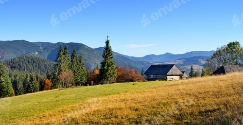 Preview: Beautiful landscape with old wooden hut in the Carpathians mount