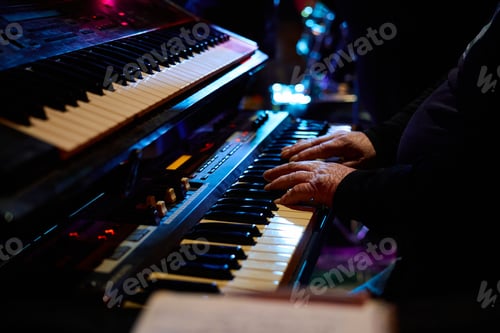 Preview: Heavy metal concert showcasing passionate keyboard performance on stage
