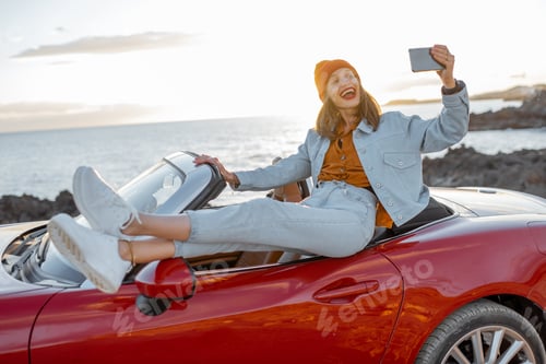 Preview: Woman vlogging on phone while travel on the ocean coast