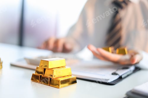 Preview: Gold Trading Businessman invest in trading gold, calculating profit price of buy and sell gold.