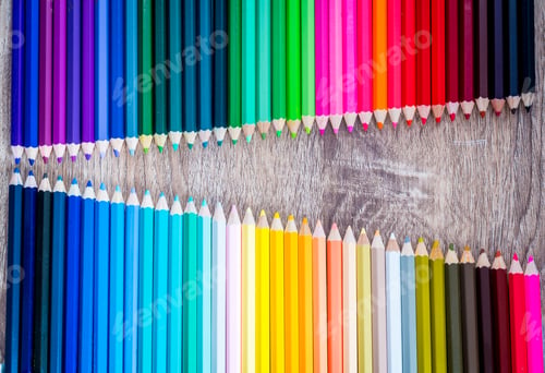 Preview: Multi Color pencils in scale with rainbow style isolated on wooden background
