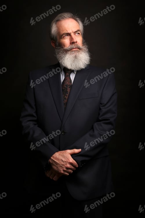 Preview: mature male model wearing suit with grey hairstyle and beard