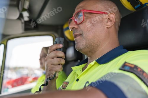 Preview: Paramedic using walkie talkie while driving ambulance during emergency
