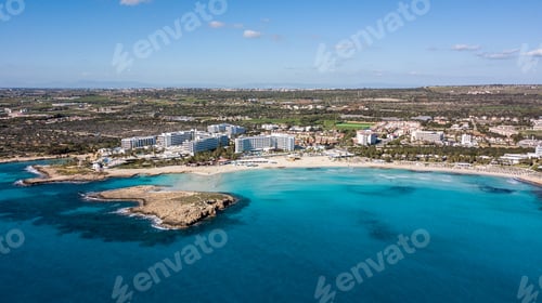 Preview: aerial view of touristic town on seashore with blue sky and sea, Cyprus